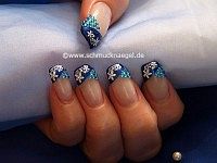 Strass stones and nail lacquer in blue