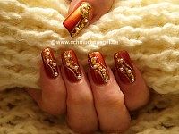 Fingernails decorated with beaten gold
