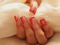 Nail art in bright red with strass stones