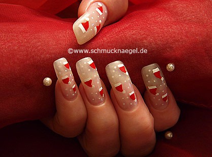 Sombrero de santa claus en uñas decoradas