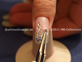 Mariposa tridimensional y pinzeta