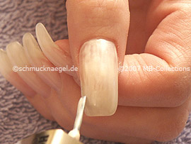 Nail polish in the colour bright beige