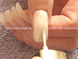 Nail polish in the colour bright beige