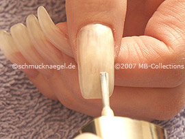 Nail polish in the colour bright beige