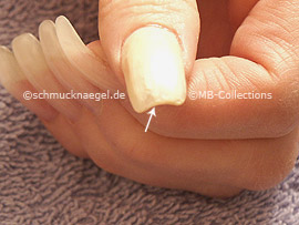 Nail polish in the colour bright beige