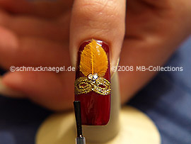 The clear nail lacquer protects the nail art