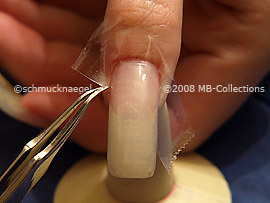 Clear adhesive tape and tweezers