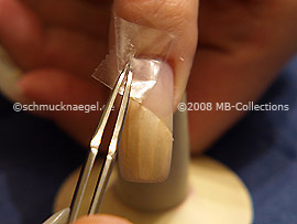 Tweezers and clear adhesive tape