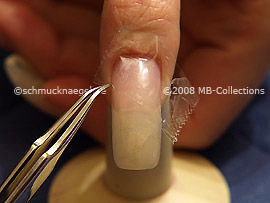 Clear adhesive tape and tweezers
