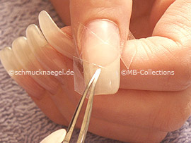 Tweezers and clear adhesive tape