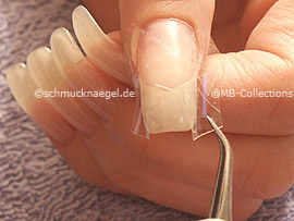 Tweezers and clear adhesive tape