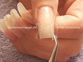 Tweezers and clear adhesive tape