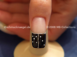 The clear nail lacquer protects the nail art