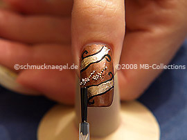 The clear nail lacquer protects the nail art