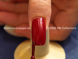 Nail lacquer in the colour red