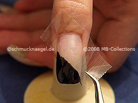 Tweezers and clear adhesive tape