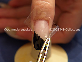 Tweezers and clear adhesive tape