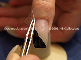 Tweezers and clear adhesive tape