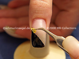 Beaten gold and the tweezers