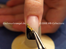 Beaten gold and the tweezers