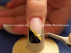 Beaten gold and the tweezers