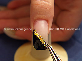 Beaten gold and the tweezers