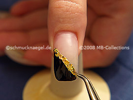 Beaten gold and the tweezers