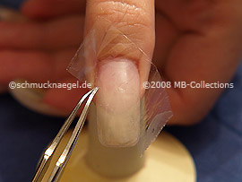 Clear adhesive tape and tweezers
