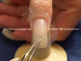 Clear adhesive tape and tweezers