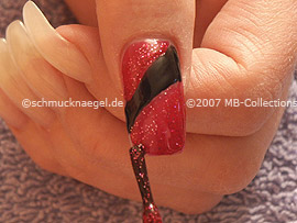 Nail polish in the colour red-glitter