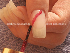 Nail polish in the colour red-glitter