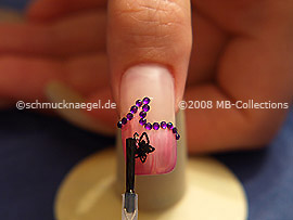 The clear nail lacquer protects the nail art