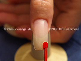 Nail polish in the colour bright red