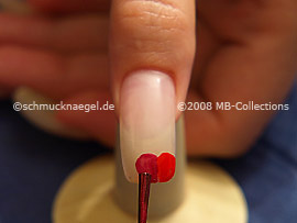 Nail polish in the colour dark red