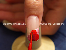 Nail polish in the colour bright red