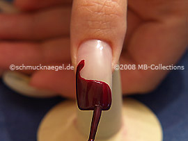 Nail lacquer in the colour claret-red