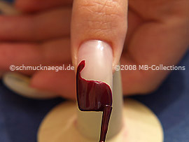 Nail lacquer in the colour claret-red