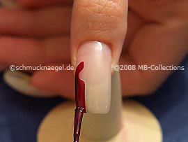 Nail lacquer in the colour claret-red