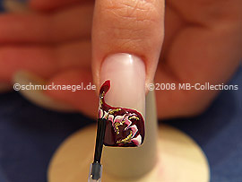 The clear nail lacquer protects the nail art