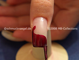 Nail lacquer in the colour claret-red