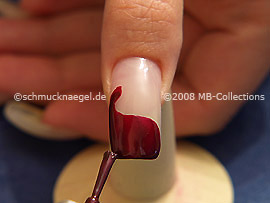 Nail lacquer in the colour claret-red