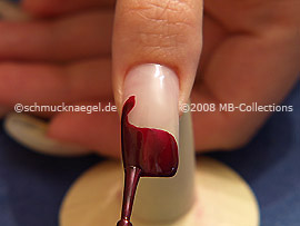 Nail lacquer in the colour claret-red