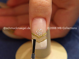 The clear nail lacquer protects the nail art