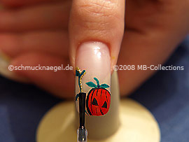 The clear nail lacquer protects the nail art