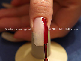 Nail lacquer in the colour dark red