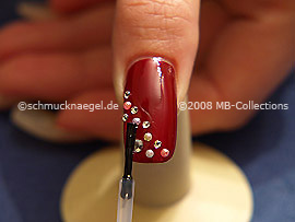 The clear nail lacquer protects the nail art