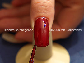 Nail lacquer in the colour dark red