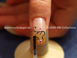 The clear nail lacquer protects the nail art