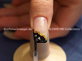 The clear nail lacquer protects the nail art