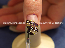 The clear nail lacquer protects the nail art